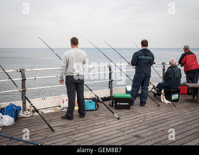 Men fishing from Saltburn`s Victorian pier. Saltburn by the sea, North Yorkshire, England. UK Stock Photo